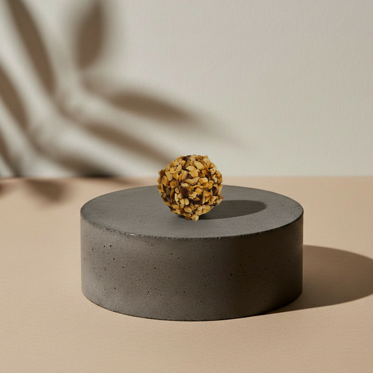 Gourmessa Rocher on concrete pedestal